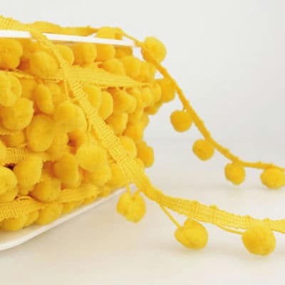 Braid trim with pompoms - yellow