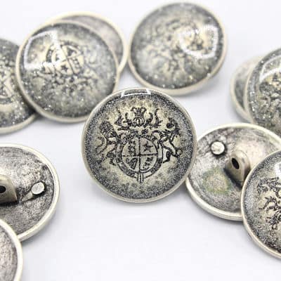 Old metal button with coat of arms