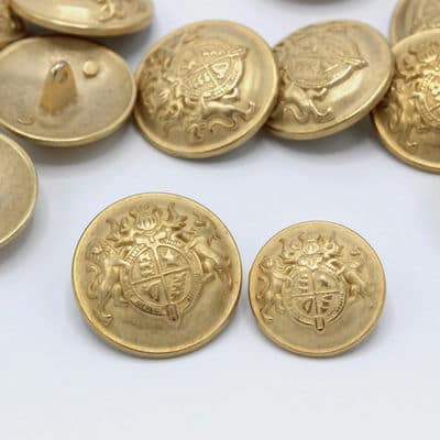 Gold metal button with coat of arms