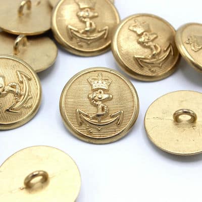 Gold metal button with coat of arms