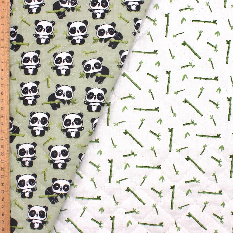 Double-sided quilted fabric with pandas - green