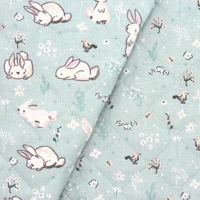 Double-sided quilted fabric with bunnies - sky blue 