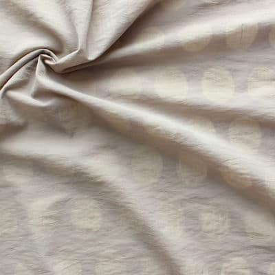 Tissu en coton et polyamide à pois sur fond beige