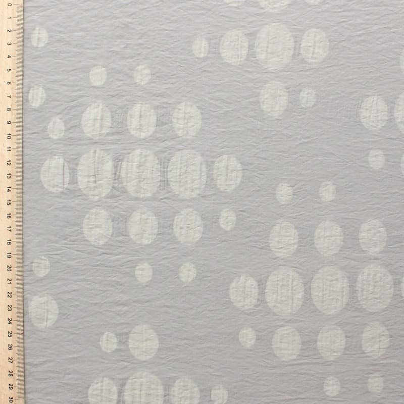 Cotton and polyamide fabric with dots on beige background