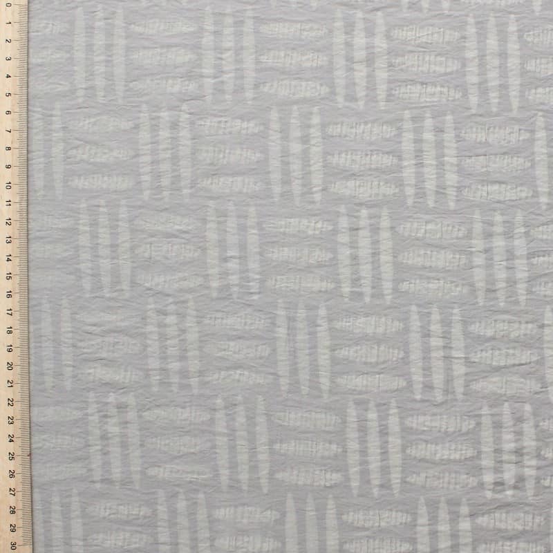 Cotton and polyamide fabric with designs on beige background