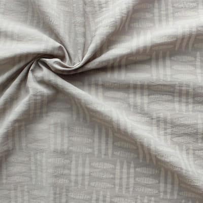 Tissu en coton et polyamide à motifs sur fond beige
