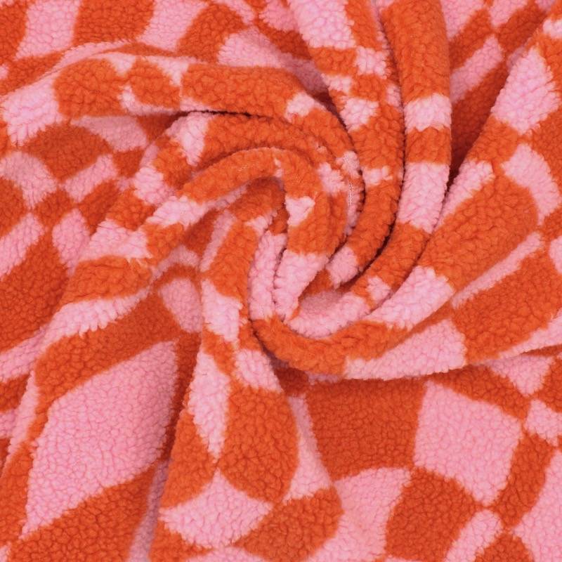 Bouclé stof met grafische print - roos en oranje