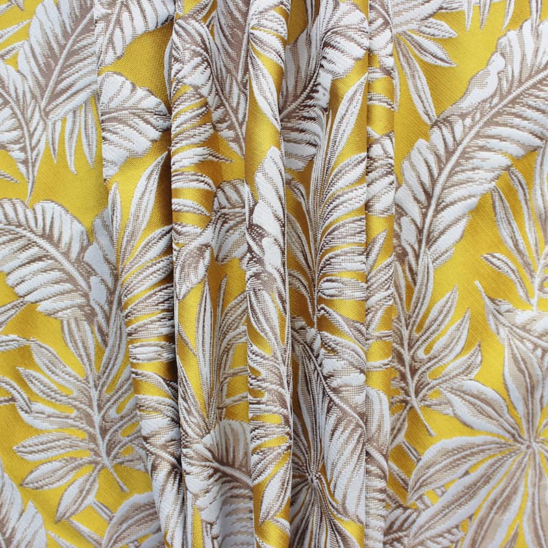 Polyester fabric with pink parrots and beige leaves on yellow background